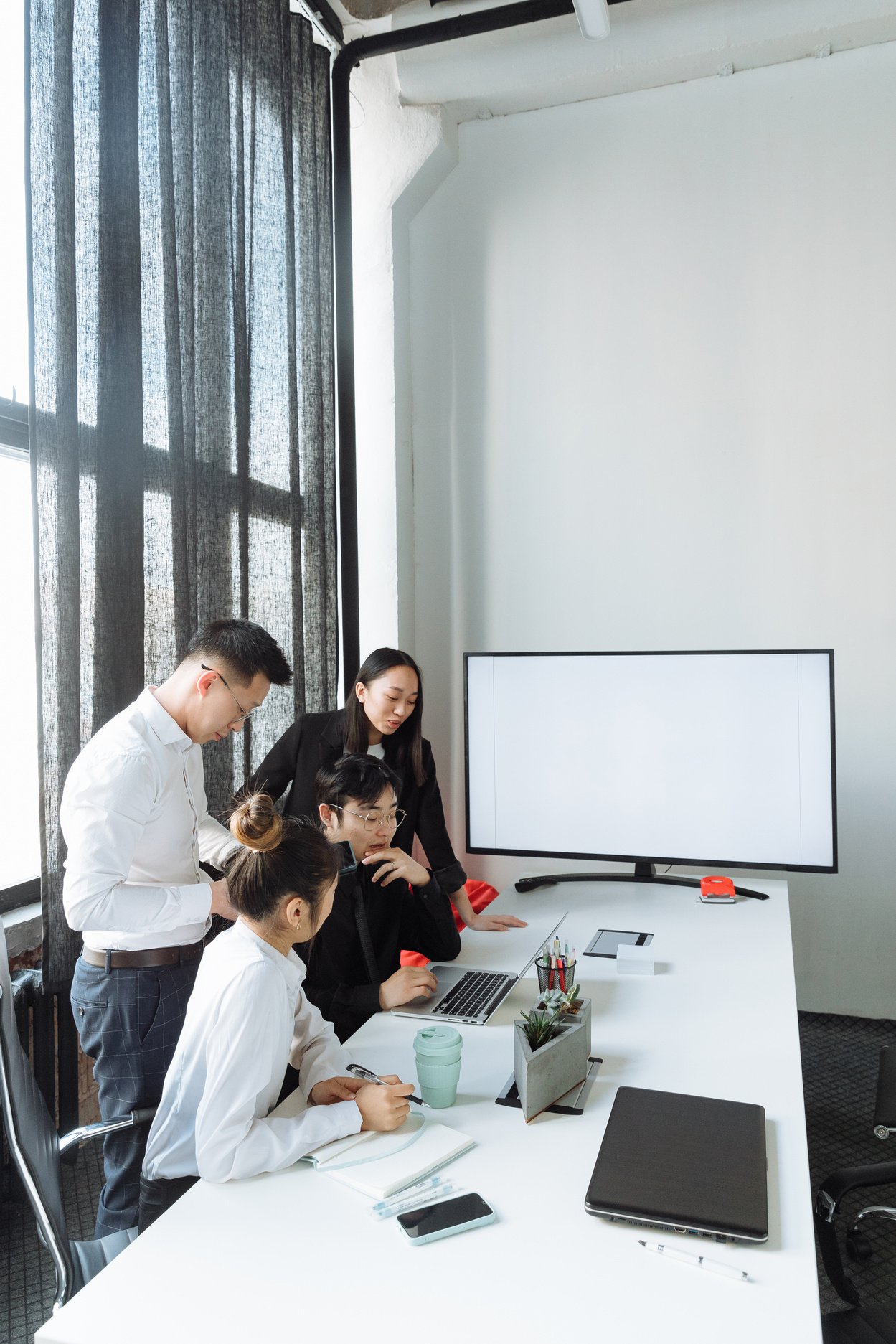 A Group of People Having a Meeting in the Office